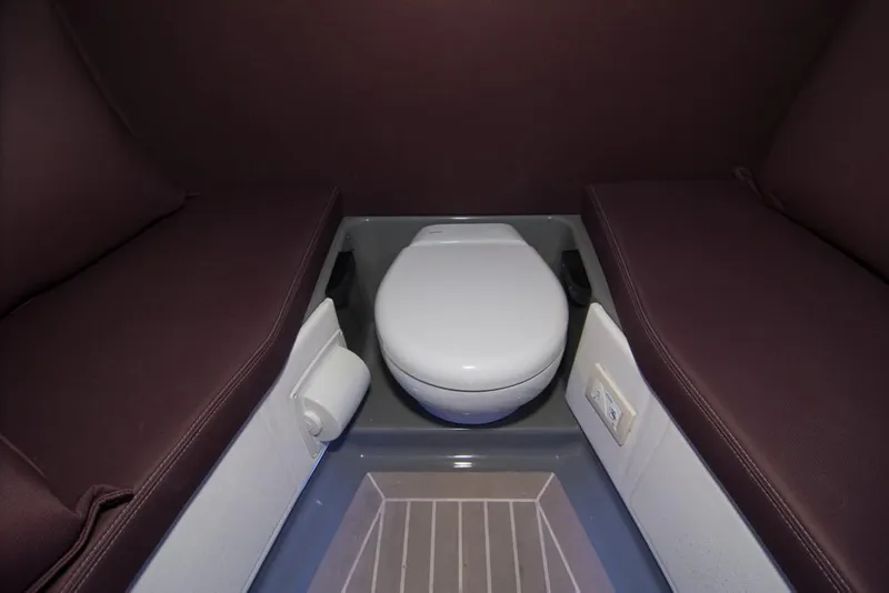 Slide: The Image of 2019 Donzi 41 GT boat interior with toilet and seating area. - 48