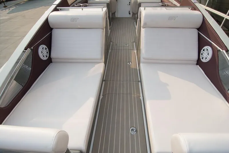Slide: The Image of 2019 Donzi 41 GT boat interior with white cushioned seating and teak flooring. - 9