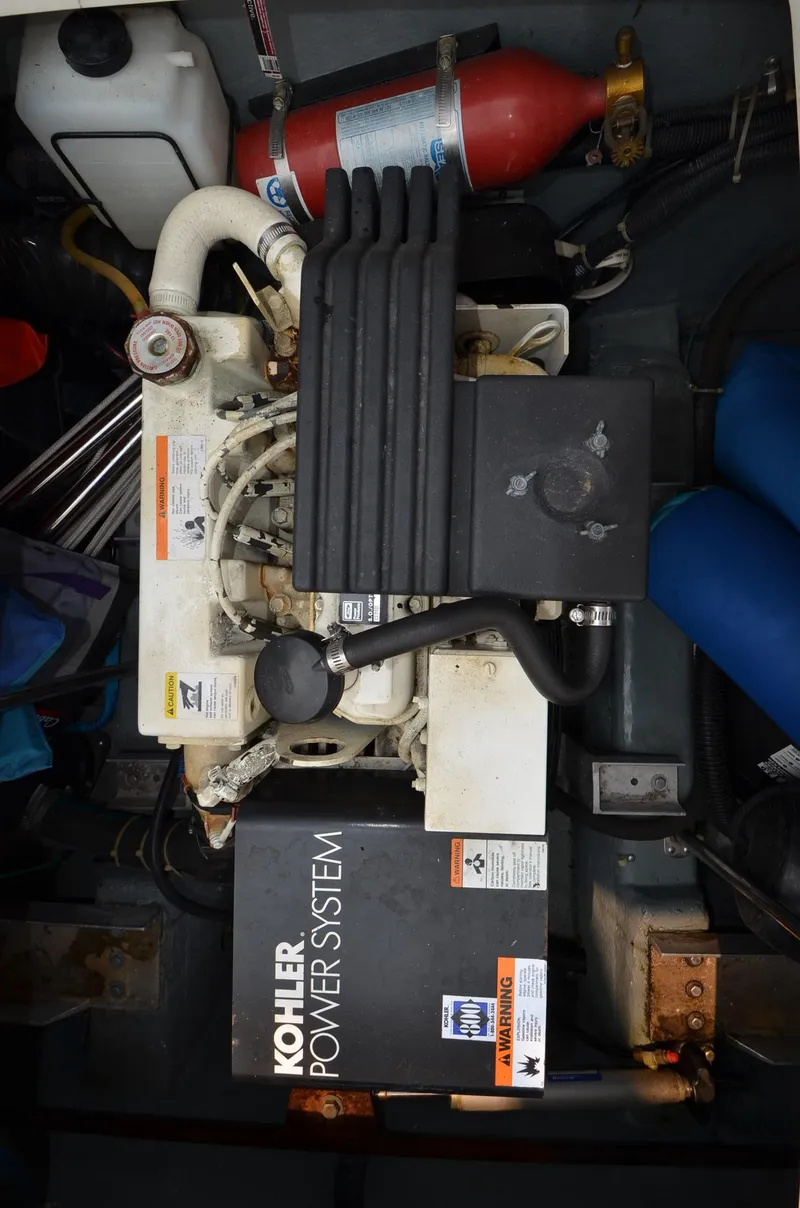 Slide: The Image of 1995 Carver 370 Voyager engine room with Kohler power system. - 25