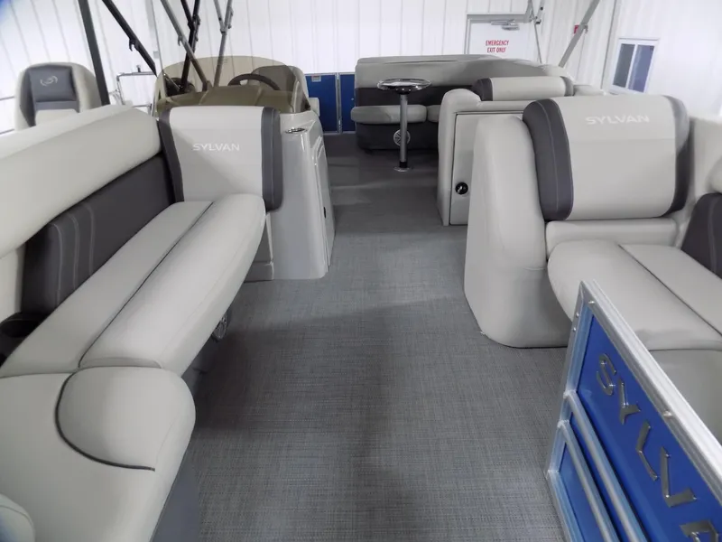 Slide: The Image of 2023 Sylvan 8522 Mirage Cruise interior with plush seating and modern design. - 3