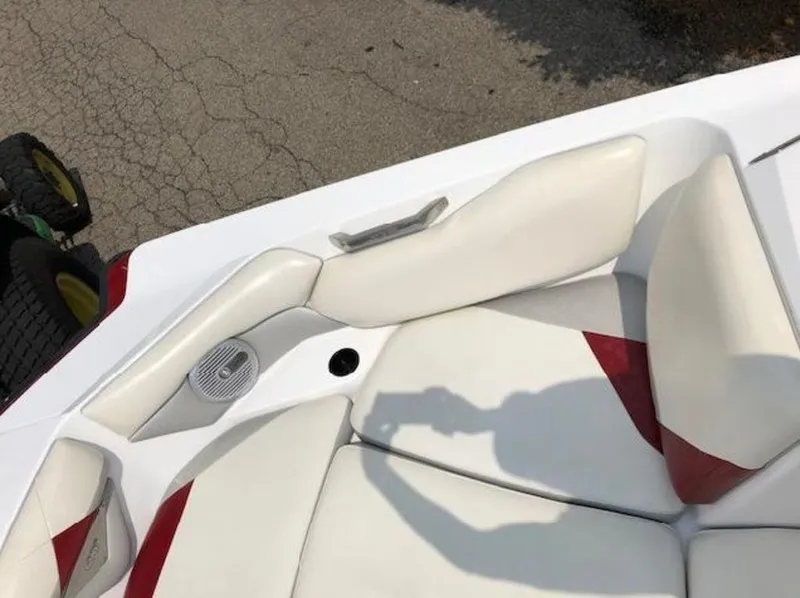 Slide: The Image of Interior of 2012 Axis Wake Research A-22 boat with white and red seating. - 10