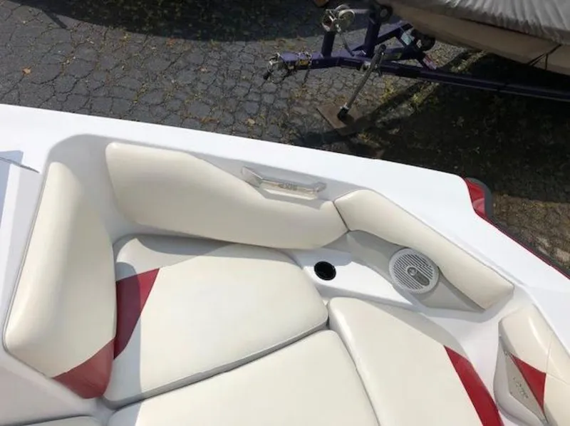 Slide: The Image of 2012 Axis Wake Research A-22 boat interior with white and red seating. - 12