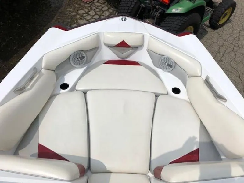 Slide: The Image of 2012 Axis Wake Research A-22 boat interior with white and red seating. - 22