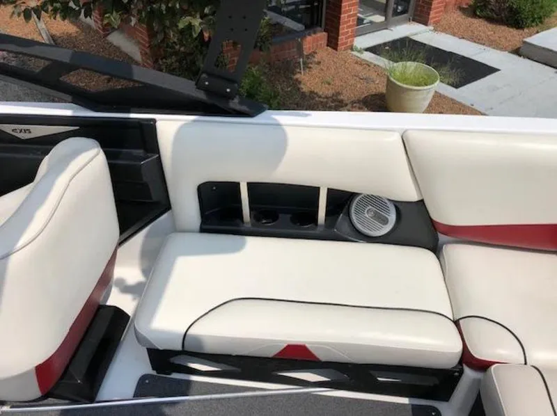 Slide: The Image of Interior of 2012 Axis Wake Research A-22 boat with white and red seating. - 27