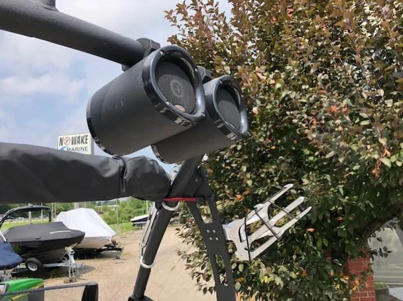 Slide: The Image of 2012 Axis Wake Research A-22 boat speakers and wakeboard rack near marina. - 29