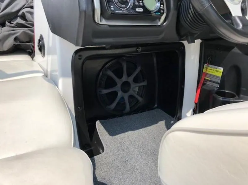 Slide: The Image of Interior of 2012 Axis Wake Research A-22 boat showing speaker and dashboard controls. - 33