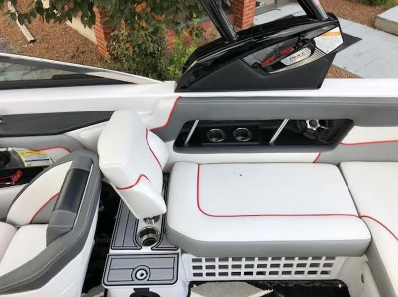 Slide: The Image of Interior of 2013 Nautique Super Air Nautique 230 boat with white and gray seating. - 19