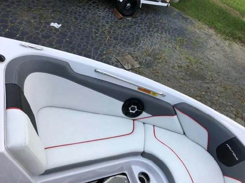 Slide: The Image of Interior seating of 2013 Nautique Super Air Nautique 230 boat with white and gray upholstery. - 33