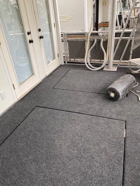 Slide: The Image of 2004 Sumerset Wind Walker boat deck with carpet and fender. - 18