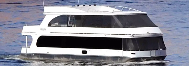 Slide: The Image of 2011 Bravada Knot A Problem Share 6 houseboat cruising on water. - 1