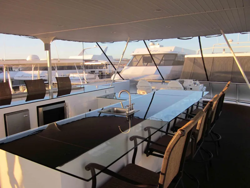 Slide: The Image of Luxurious 2011 Bravada Knot A Problem Share 6 yacht with spacious outdoor seating area. - 13