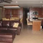 Slide: The Image of Luxurious interior of 2011 Bravada Knot A Problem Share 6 with leather sofa and modern kitchen. - 2