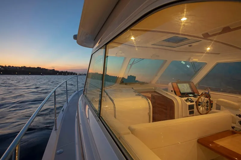 Slide: The Image of 2024 Back Cove 34O yacht interior at sunset on the water. - 17