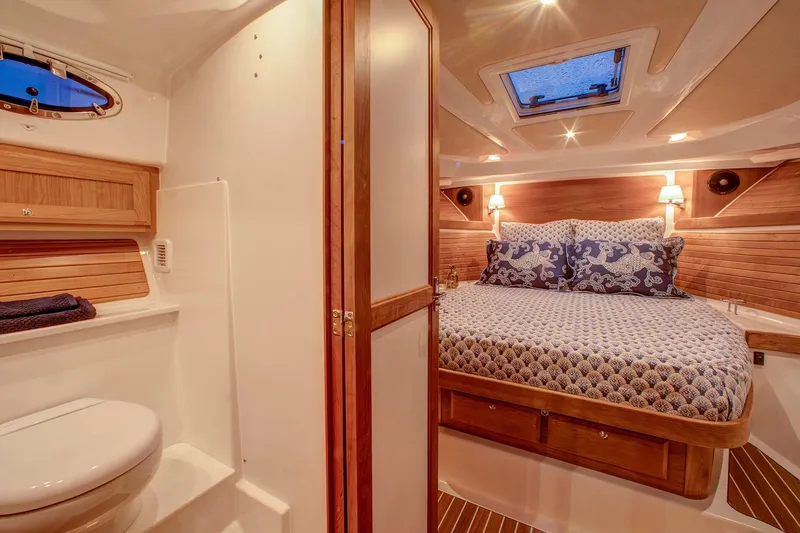 Slide: The Image of Luxurious cabin interior of 2024 Back Cove 34O yacht with cozy bed and modern amenities. - 21