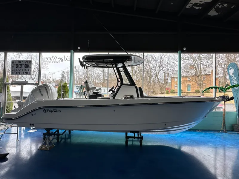 The Image of 2025 Edgewater 230CC Center Console boat displayed indoors. - 0