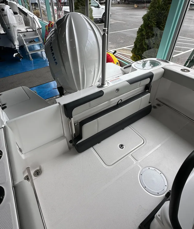 Slide: The Image of 2025 Edgewater 230CC Center Console boat interior with Yamaha outboard motor. - 10