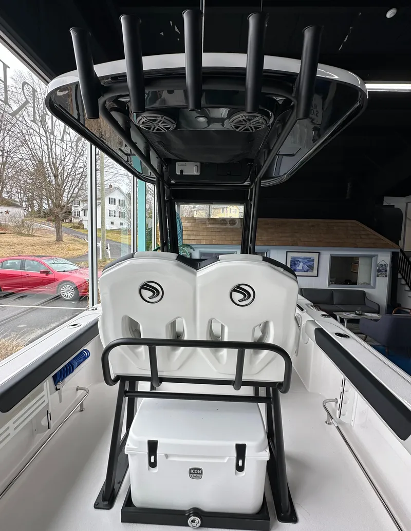 Slide: The Image of 2025 Edgewater 230CC Center Console boat interior with seating and storage. - 12