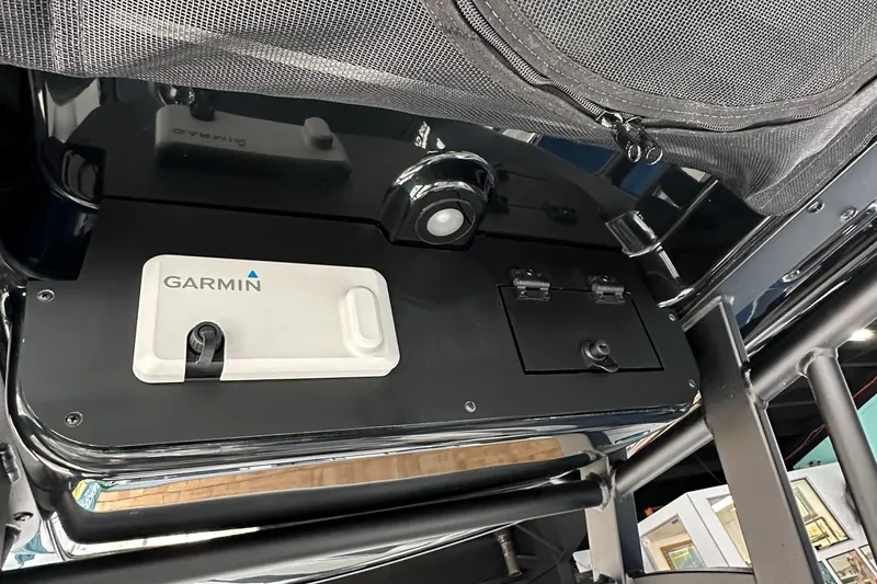 Slide: The Image of 2025 Edgewater 230CC Center Console with Garmin electronics and overhead storage. - 17