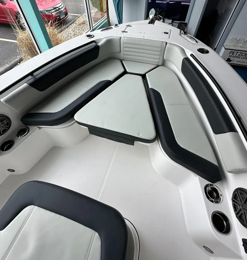 Slide: The Image of 2025 Edgewater 230CC Center Console boat interior with cushioned seating and modern design. - 23