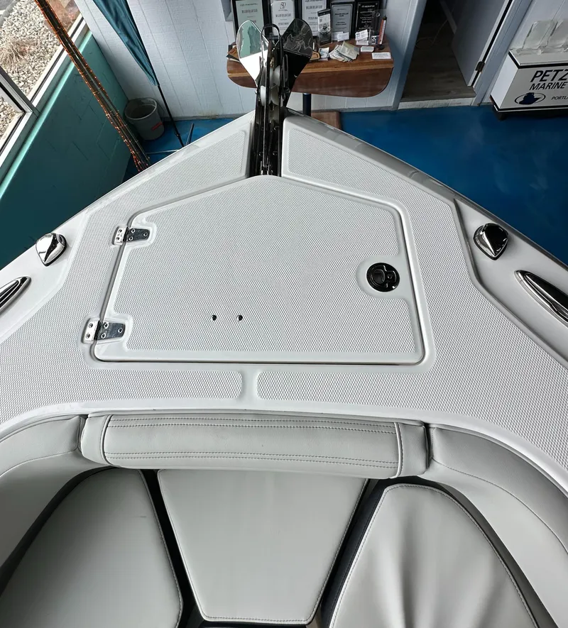 Slide: The Image of 2025 Edgewater 230CC Center Console boat interior, featuring sleek design and storage compartment. - 24