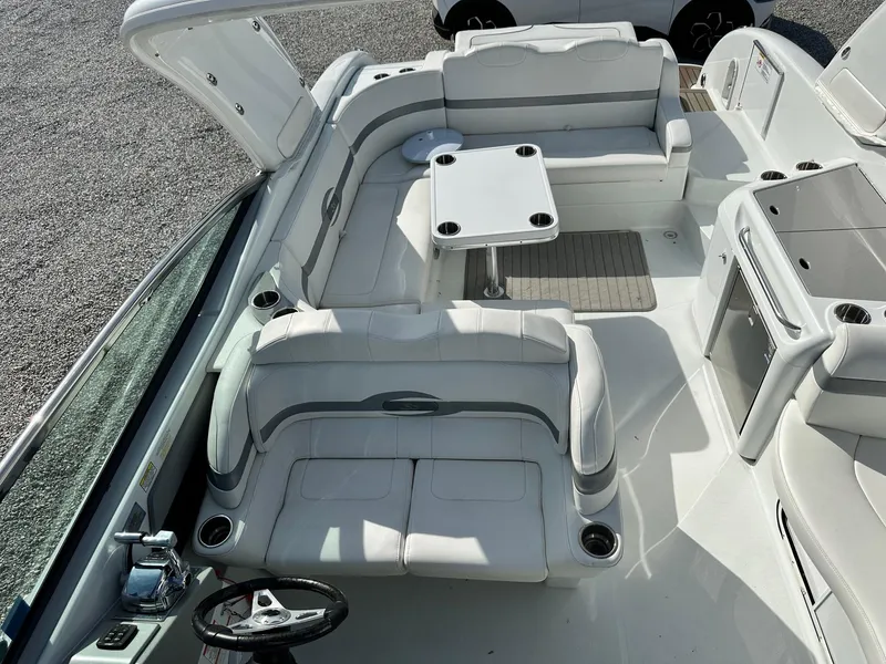 Slide: The Image of 2012 Formula 350 Sun Sport boat interior with white seating and table. - 13