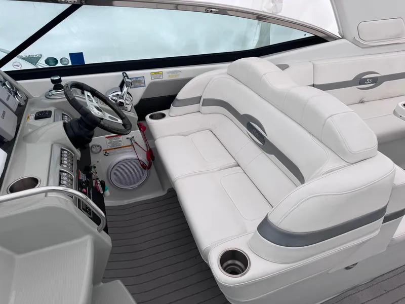 Slide: The Image of Interior of a 2012 Formula 350 Sun Sport boat with white seating and steering console. - 17