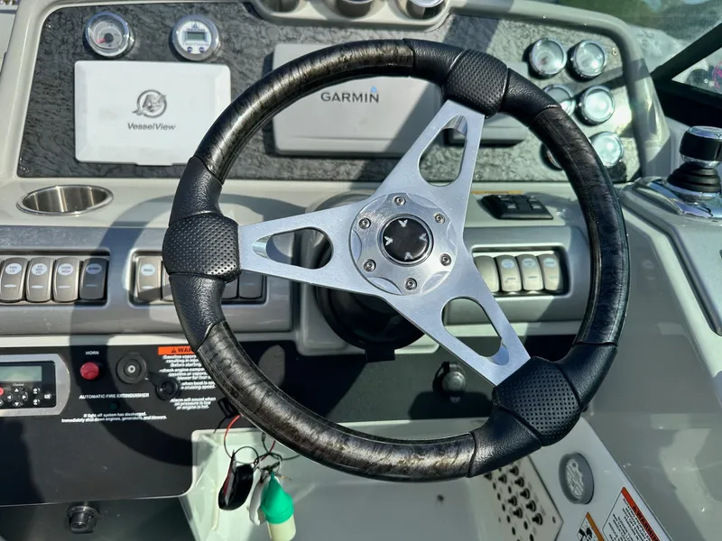 Slide: The Image of Steering wheel of a 2012 Formula 350 Sun Sport boat with Garmin navigation system. - 18