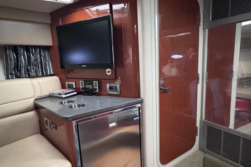 Slide: The Image of Interior of a 2012 Formula 350 Sun Sport boat with TV and mini-fridge. - 26