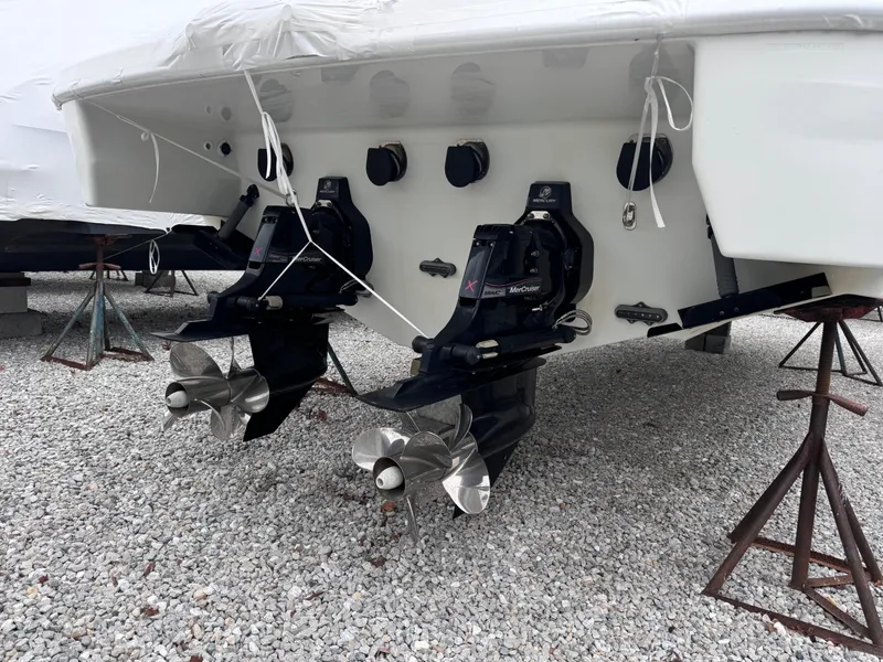 Slide: The Image of 2012 Formula 350 Sun Sport boat with dual propellers on gravel. - 3