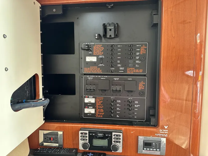 Slide: The Image of Electrical panel inside a 2012 Formula 350 Sun Sport boat, featuring control switches and displays. - 31