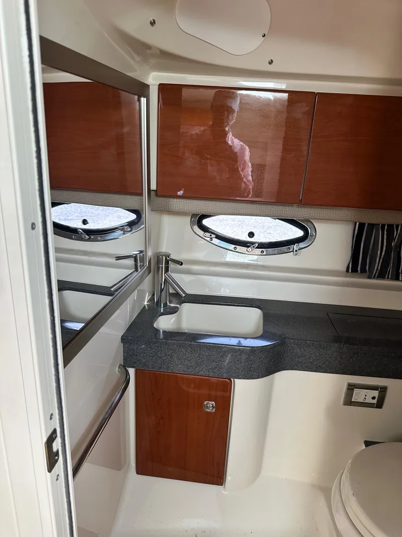 Slide: The Image of 2012 Formula 350 Sun Sport bathroom with wood cabinets and modern fixtures. - 36