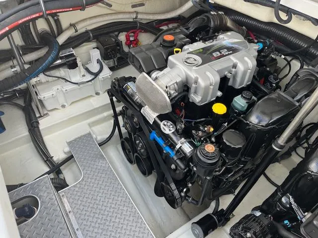 Slide: The Image of Engine compartment of a 2012 Formula 350 Sun Sport boat, showcasing detailed mechanical components. - 40