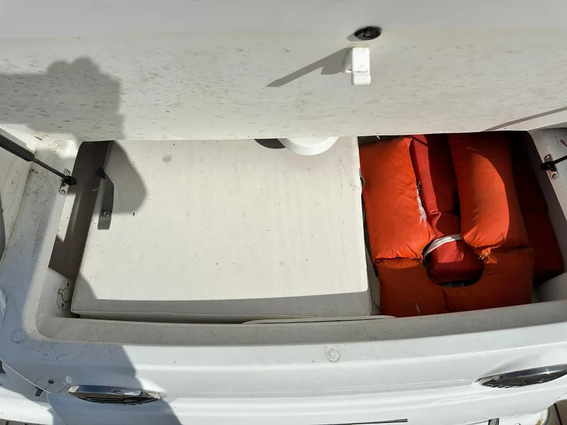 Slide: The Image of 2012 Formula 350 Sun Sport storage compartment with orange life jackets. - 5