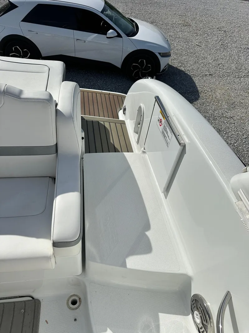 Slide: The Image of 2012 Formula 350 Sun Sport boat interior with car in background, showcasing sleek design. - 7