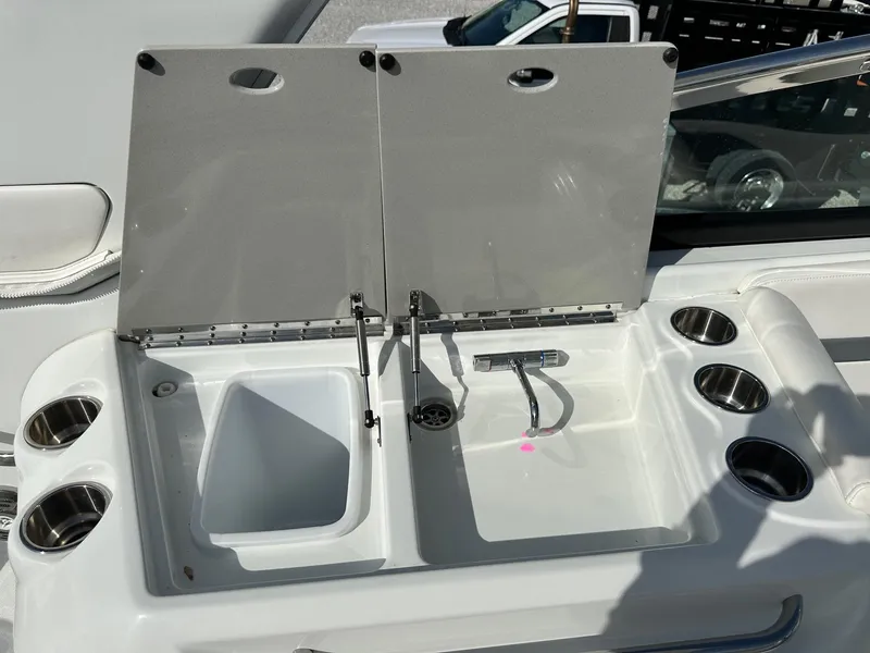 Slide: The Image of 2012 Formula 350 Sun Sport boat sink and countertop with cup holders. - 8
