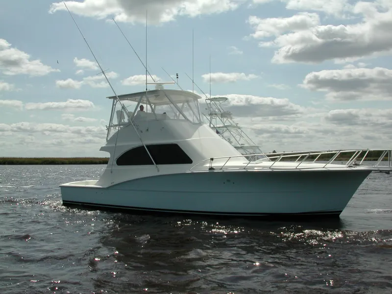 Slide: The Image of 2024 Jersey Cape 44' Custom yacht on open water under cloudy sky. - 3