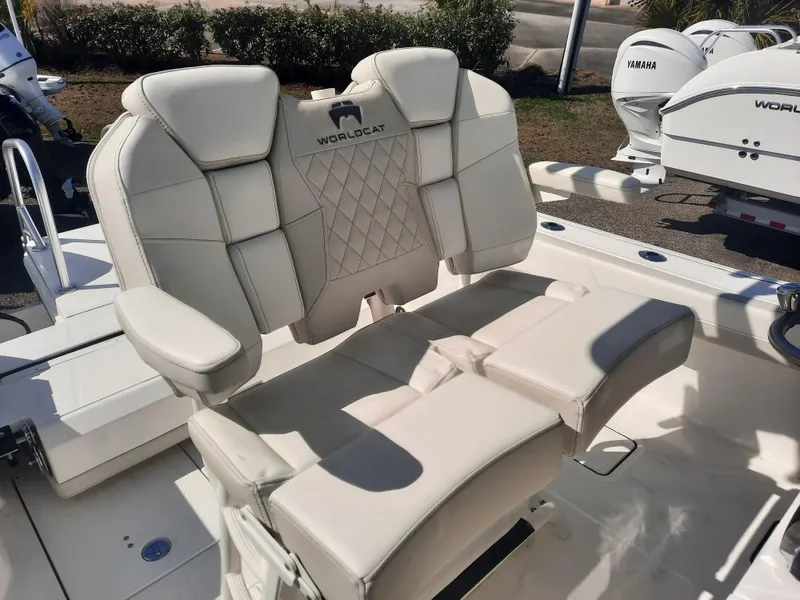 Slide: The Image of 2023 World Cat 260CC-X boat seating with white upholstery and armrests. - 3