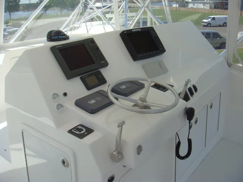 Slide: The Image of 2024 Jersey Cape 48 Custom boat helm with advanced navigation systems. - 10