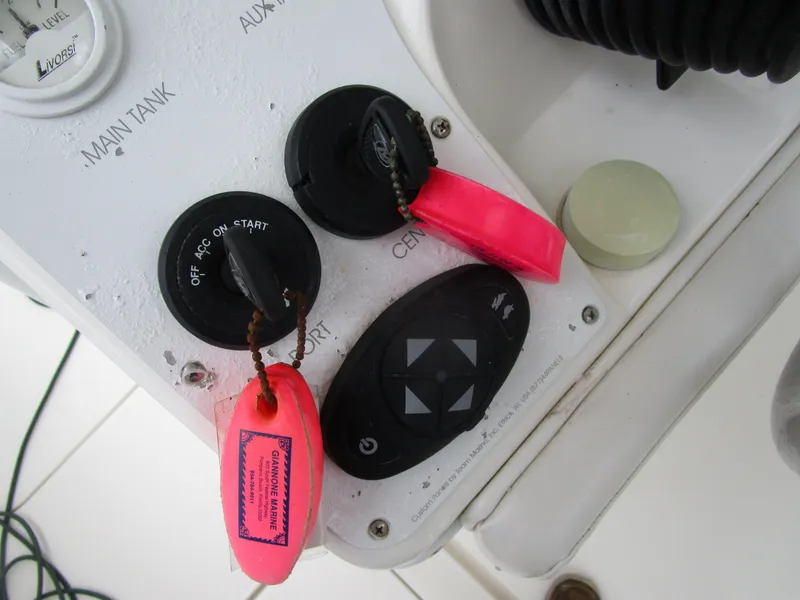 Slide: The Image of Ignition switches and controls on a 2007 Fountain 38 Tournament Edition boat. - 10