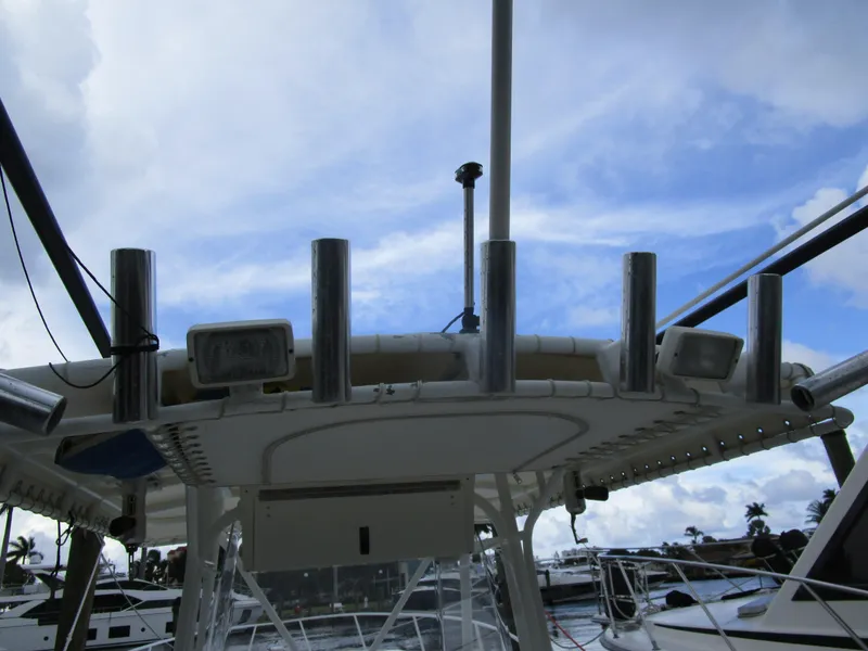 Slide: The Image of Fountain 38 Tournament Edition 2007 boat with rod holders and sky view. - 32