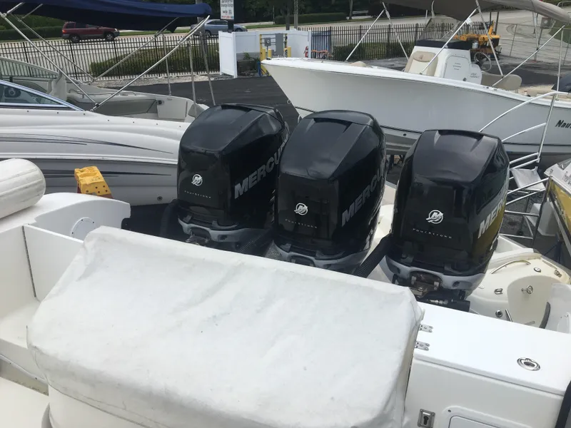 Slide: The Image of Three Mercury outboard engines on a 2007 Fountain 38 Tournament Edition boat. - 49
