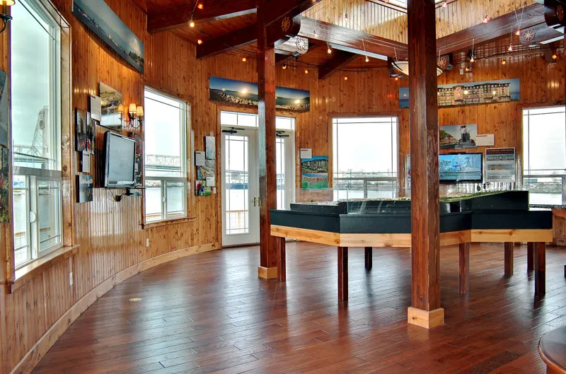 Slide: The Image of 1936 Custom Ferry interior with wooden decor and panoramic windows. - 11