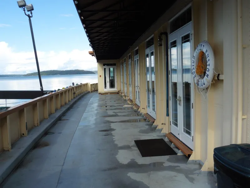 Slide: The Image of 1936 Custom Ferry deck with scenic waterfront view and exterior doors. - 17