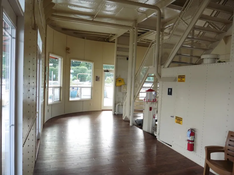 Slide: The Image of Interior of a 1936 custom ferry with wooden floors and metal stairs. - 32