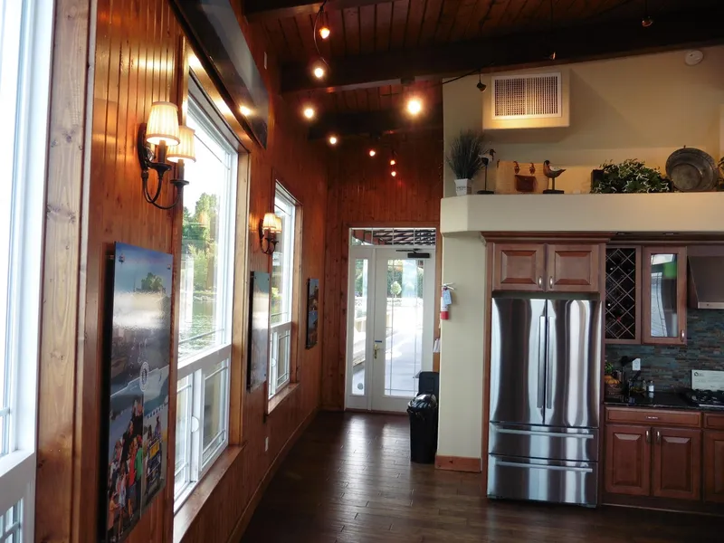 Slide: The Image of Interior of a 1936 custom ferry with wooden walls and modern kitchen. - 34