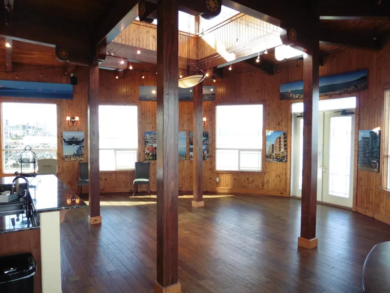 Slide: The Image of Spacious wooden interior of a 1936 custom ferry with large windows and natural light. - 36