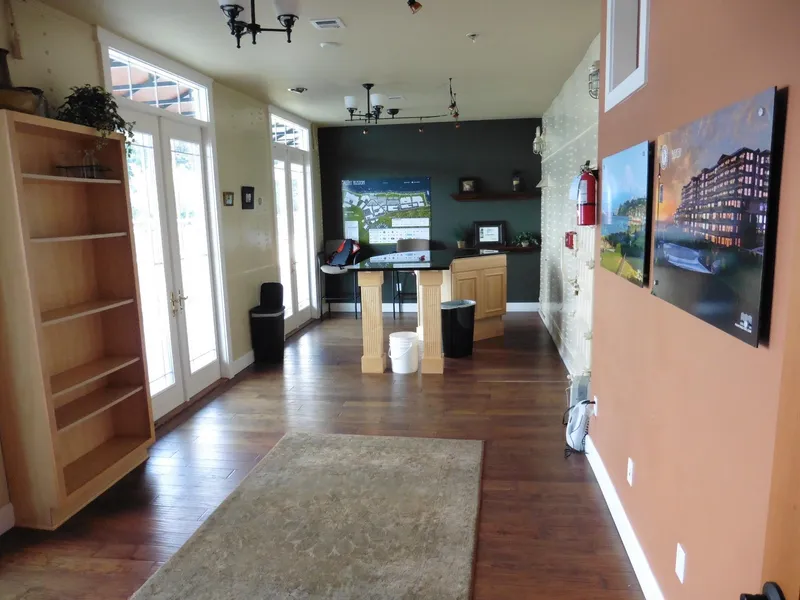 Slide: The Image of Modern office space with wooden flooring, large windows, and wall art. - 43