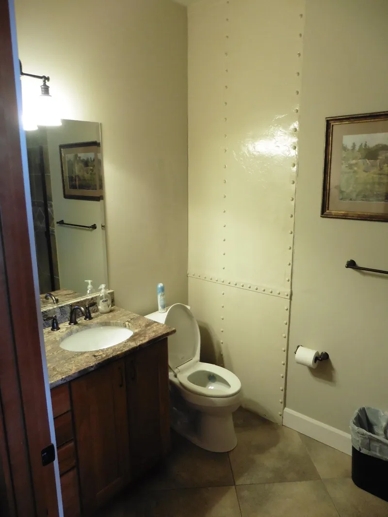 Slide: The Image of 1936 Custom Ferry bathroom with sink, toilet, and wall art. - 45