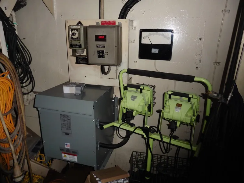 Slide: The Image of Electrical control room of a 1936 custom ferry with various equipment and wiring. - 49