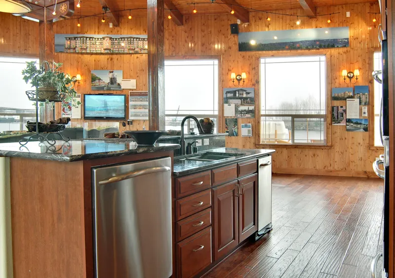 Slide: The Image of 1936 Custom Ferry interior with modern kitchen, wooden walls, and large windows. - 8